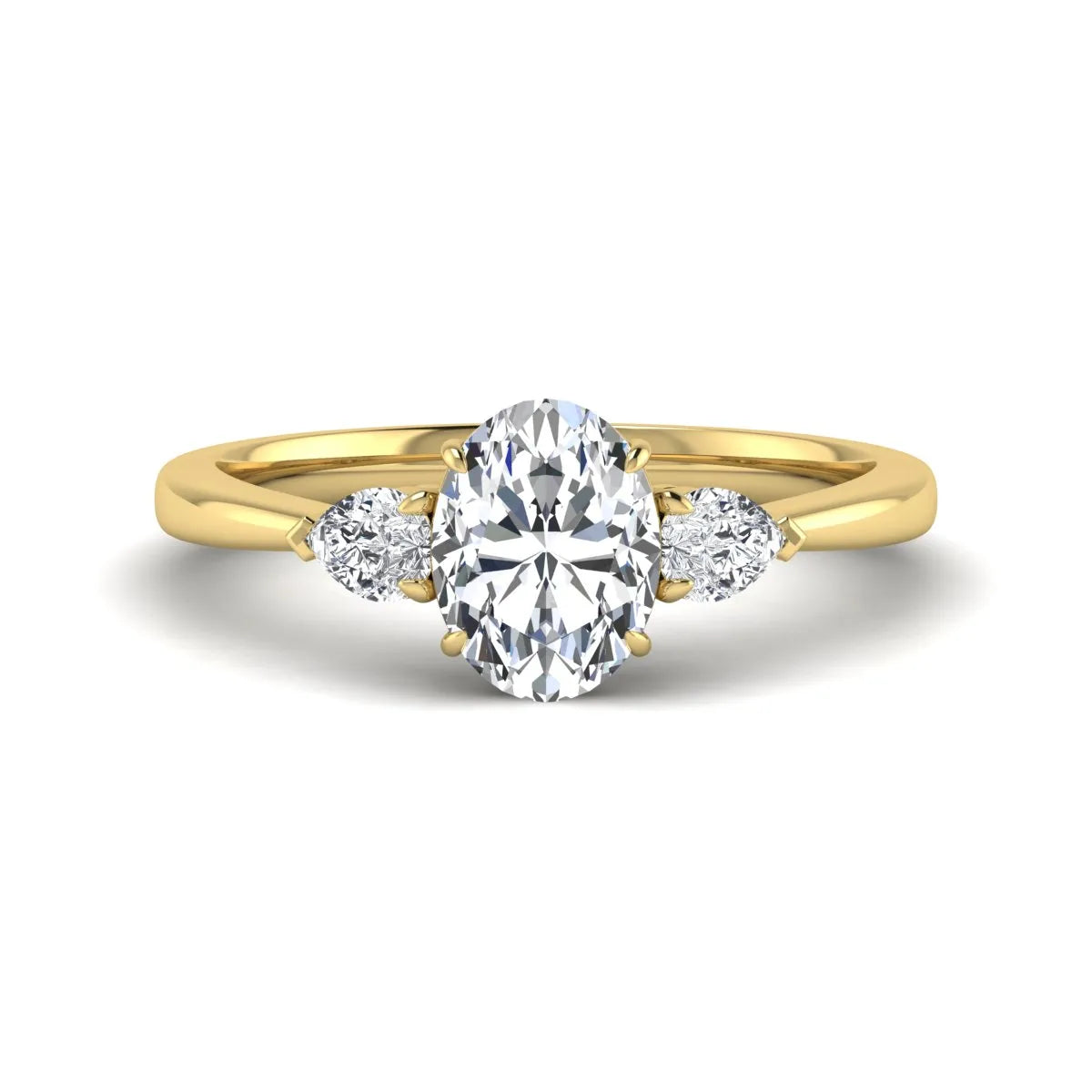 Oval cut lab grown diamond three stone engagement ring with pear cut side diamonds and prong setting in yellow gold tone.