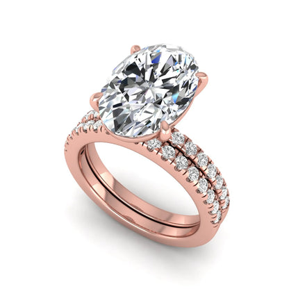 Oval Cut Pavé Solitaire Lab Grown Diamond Engagement Ring Set featuring a 3.92 carat IGI Certified oval diamond with a matching pavé diamond wedding band in rose gold.