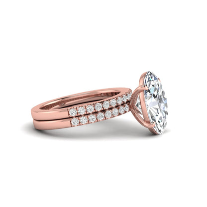 Oval Cut Pavé Solitaire Lab Grown Diamond Engagement Ring Set featuring a 3.92 carat IGI Certified oval diamond with a matching pavé diamond wedding band in rose gold.