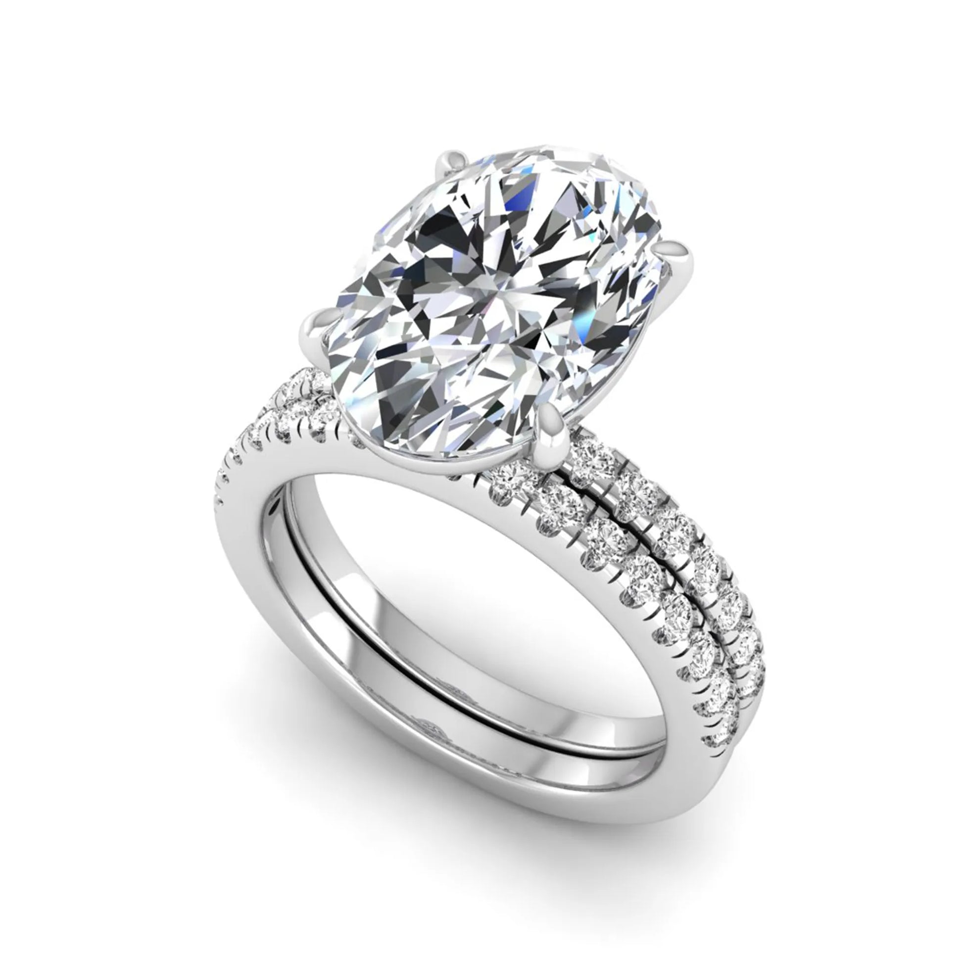 Oval Cut Pavé Solitaire Lab Grown Diamond Engagement Ring Set featuring a 3.92 carat IGI Certified oval diamond with a matching pavé diamond wedding band in white gold.
