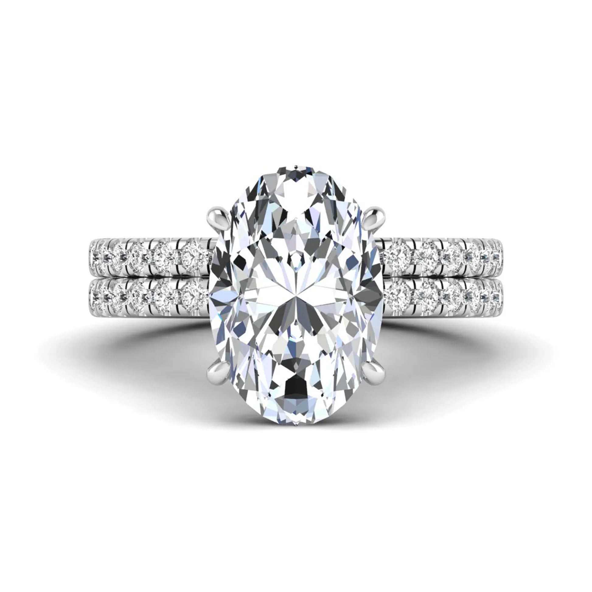 Oval Cut Pavé Solitaire Lab Grown Diamond Engagement Ring Set featuring a 3.92 carat IGI Certified oval diamond with a matching pavé diamond wedding band in white gold.