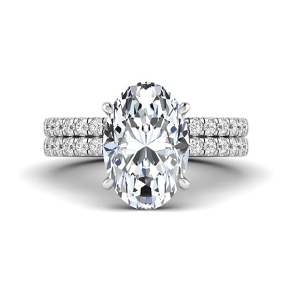 Oval Cut Pavé Solitaire Lab Grown Diamond Engagement Ring Set featuring a 3.92 carat IGI Certified oval diamond with a matching pavé diamond wedding band in white gold.