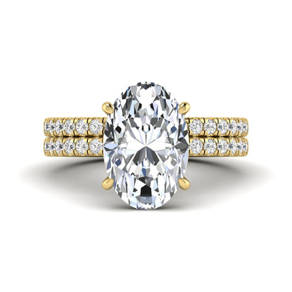 Oval Cut Pavé Solitaire Lab Grown Diamond Engagement Ring Set featuring a 3.92 carat IGI Certified oval diamond with a matching pavé diamond wedding band in yellow gold.