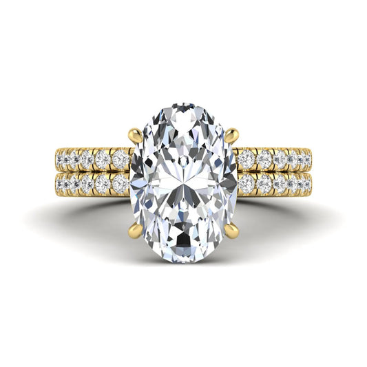 Oval Cut Pavé Solitaire Lab Grown Diamond Engagement Ring Set featuring a 3.92 carat IGI Certified oval diamond with a matching pavé diamond wedding band in yellow gold.