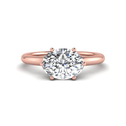 Oval cut solitaire lab grown diamond engagement ring featuring a 1.21 carat IGI certified oval cut center diamond in rose gold.