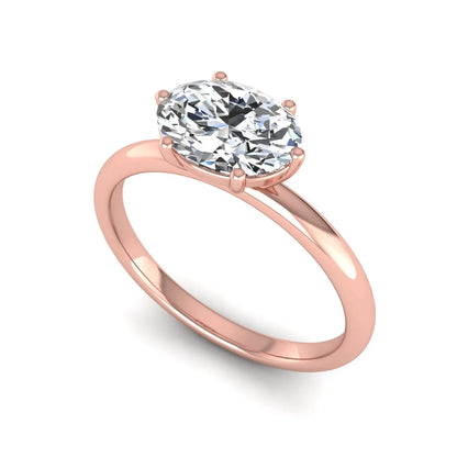 Oval cut solitaire lab grown diamond engagement ring featuring a 1.21 carat IGI certified oval cut center diamond in rose gold.