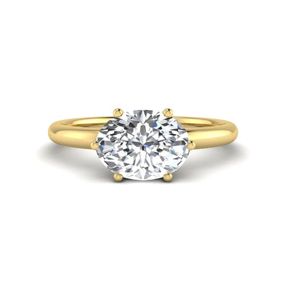 Oval cut solitaire lab grown diamond engagement ring featuring a 1.21 carat IGI certified oval cut center diamond in yellow gold.