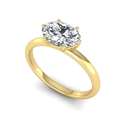 Oval cut solitaire lab grown diamond engagement ring featuring a 1.21 carat IGI certified oval cut center diamond in yellow gold.