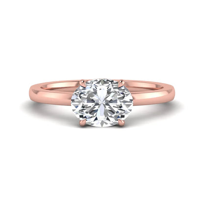 IGI certified oval cut lab grown diamond solitaire engagement ring in rose gold.