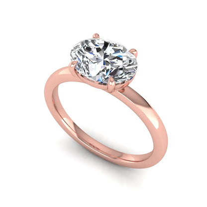IGI certified oval cut lab grown diamond solitaire engagement ring in rose gold.