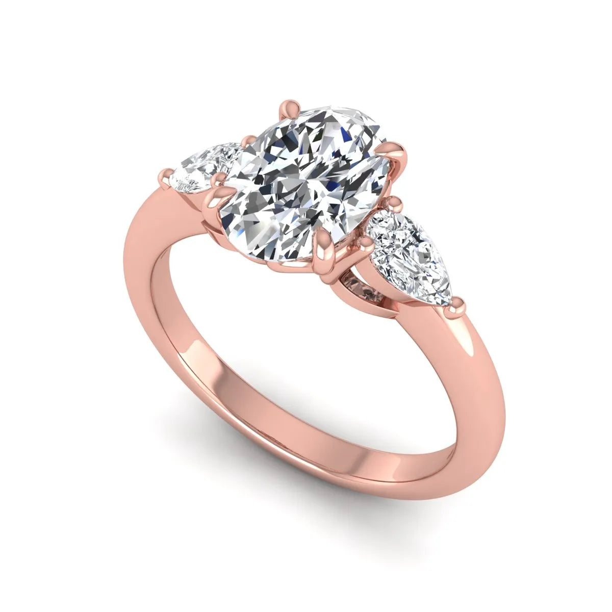 Oval cut three stone lab grown diamond engagement ring in rose gold featuring a 1.31 carat IGI certified center diamond with pear cut side diamonds.
