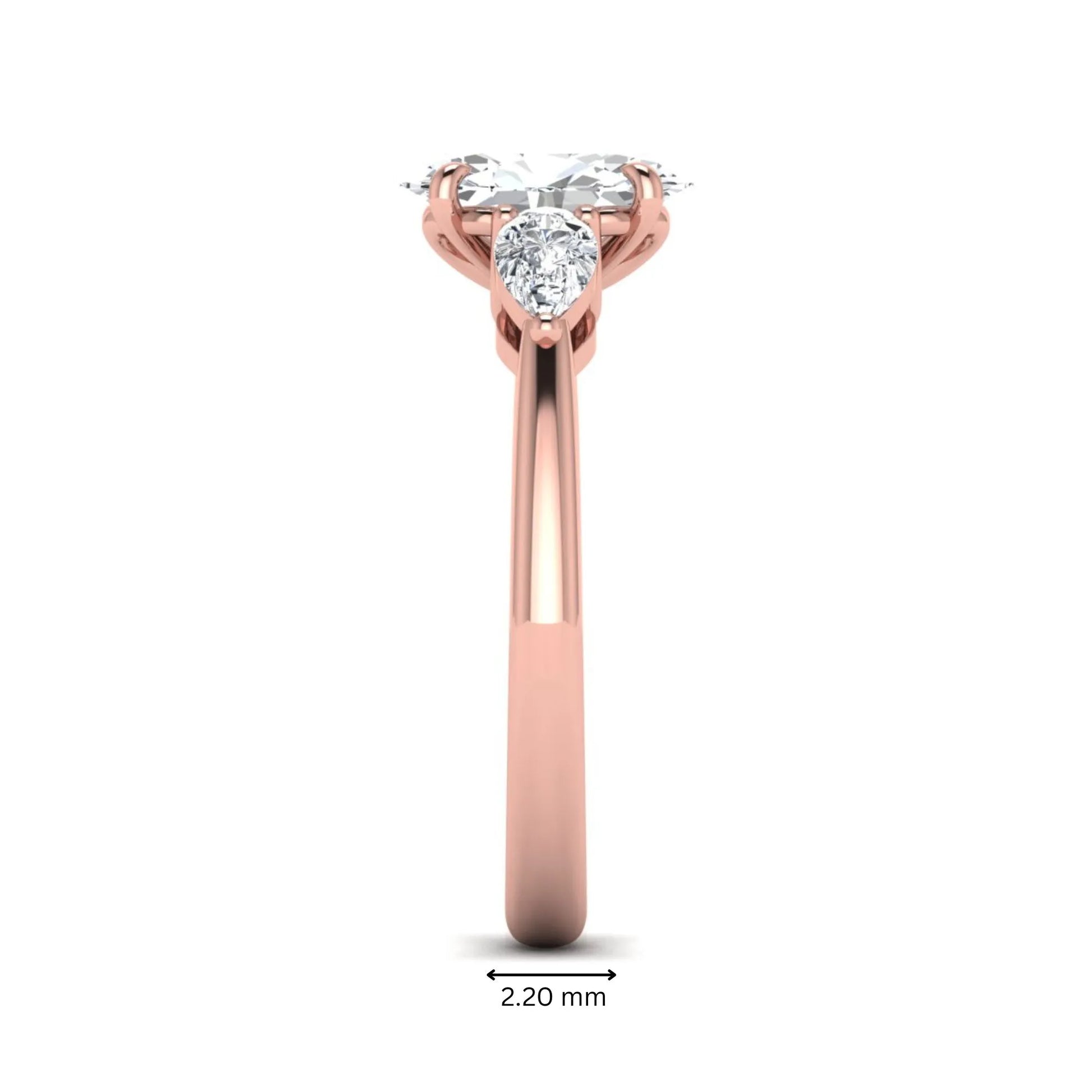 Oval cut three stone lab grown diamond engagement ring in rose gold featuring a 1.31 carat IGI certified center diamond with pear cut side diamonds.