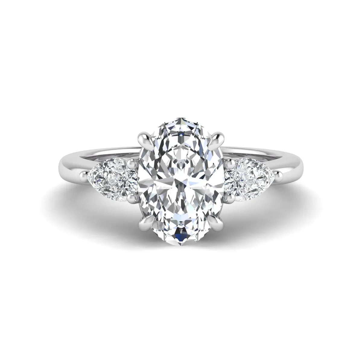 Oval cut three stone lab grown diamond engagement ring in white gold featuring a 1.31 carat IGI certified center diamond with pear cut side diamonds.