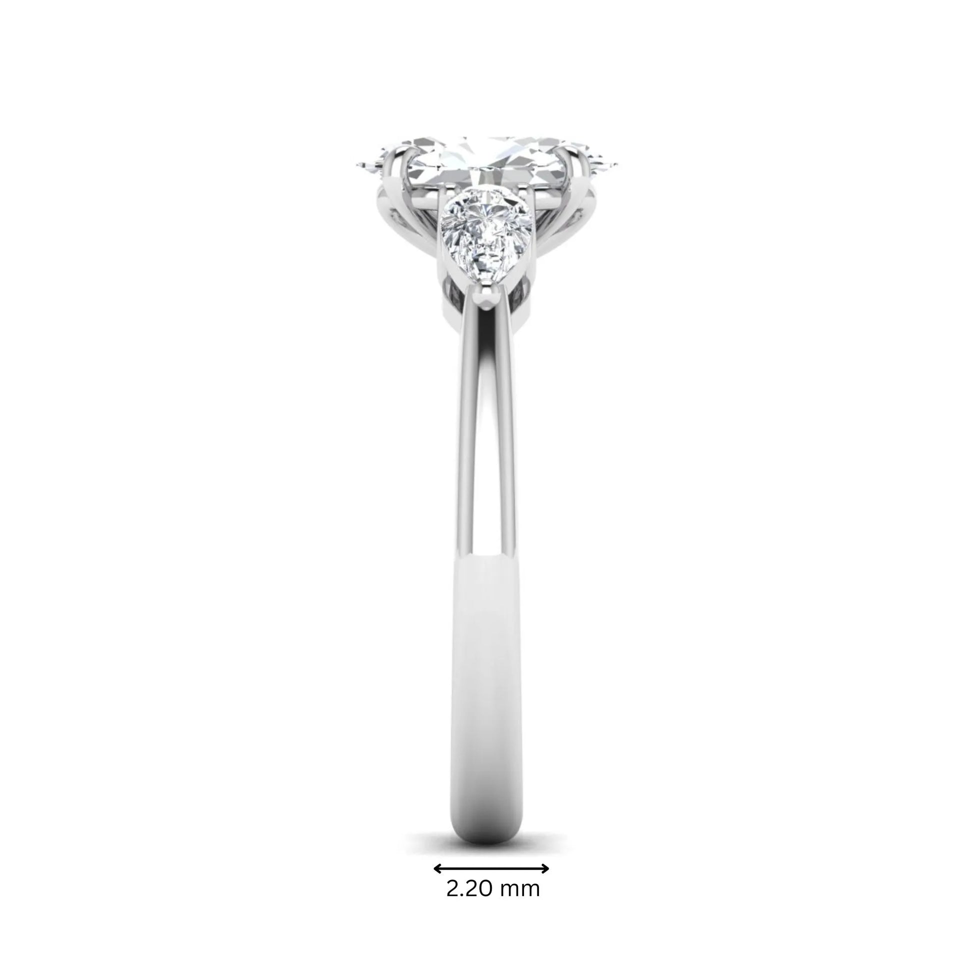 Oval cut three stone lab grown diamond engagement ring in white gold featuring a 1.31 carat IGI certified center diamond with pear cut side diamonds.