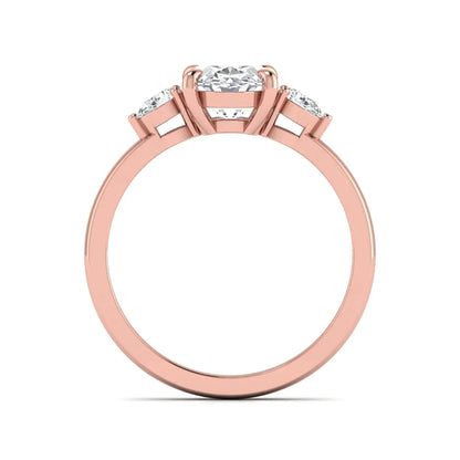 Oval cut lab grown diamond three stone engagement ring with pear side diamonds in rose gold.