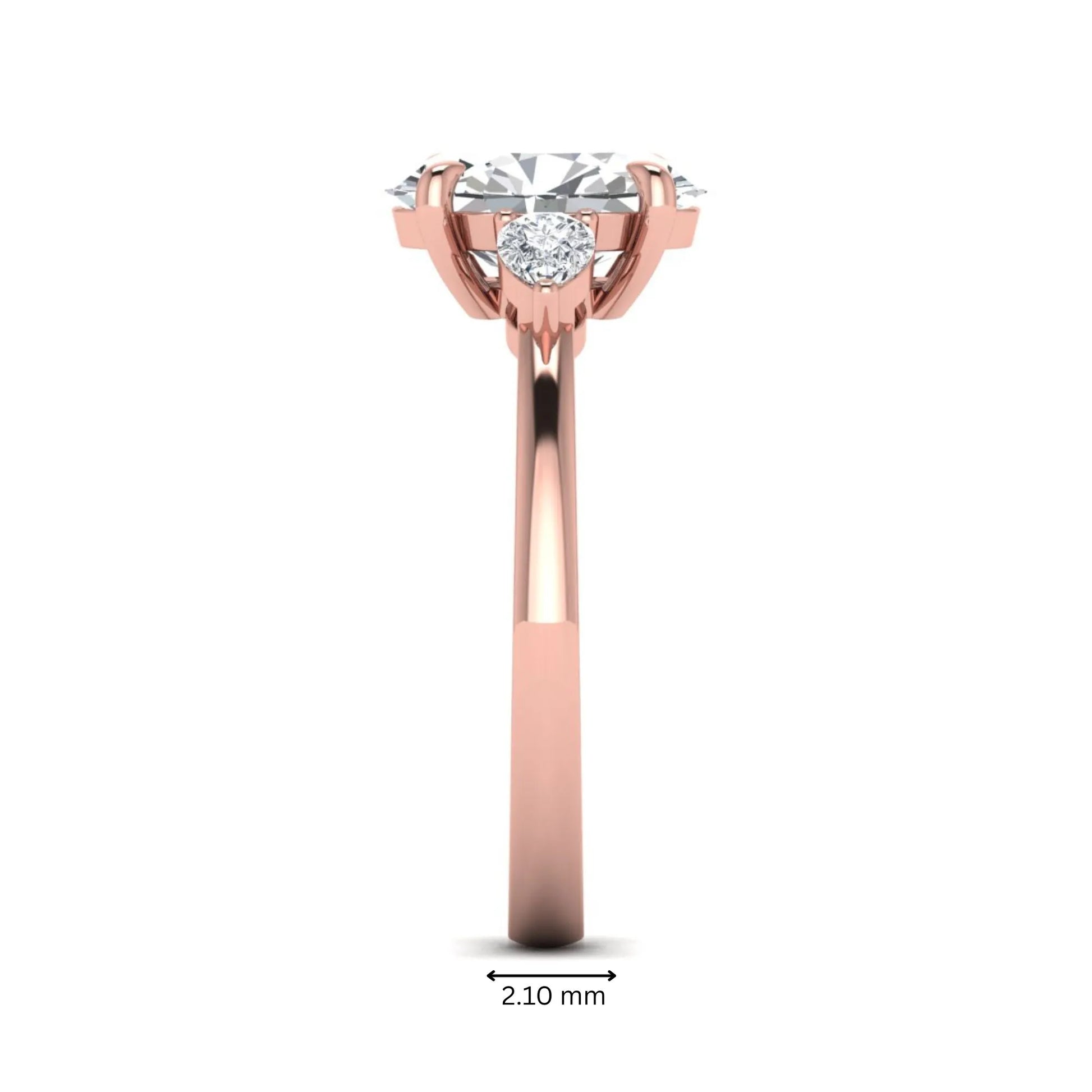 Oval cut lab grown diamond three stone engagement ring with pear side diamonds in rose gold.