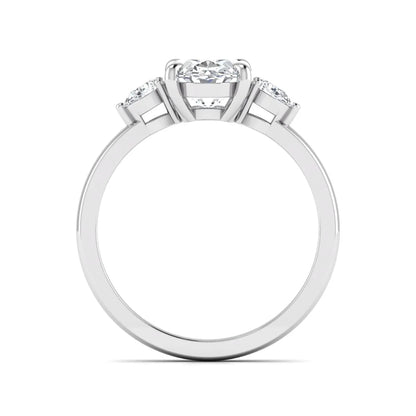 Oval cut lab grown diamond three stone engagement ring with pear side diamonds in white gold.