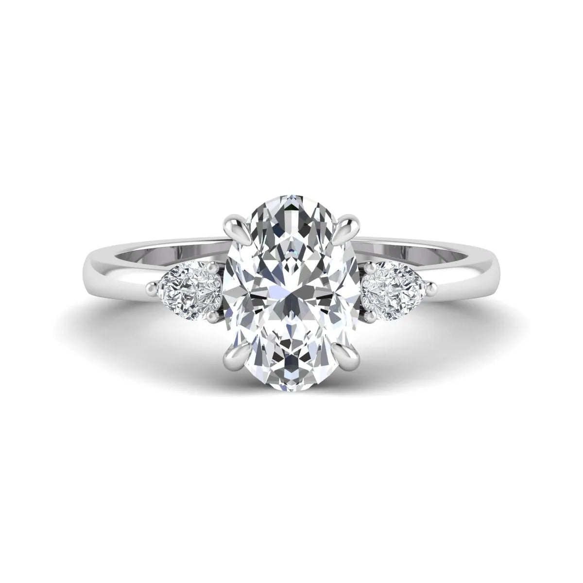 Oval cut lab grown diamond three stone engagement ring with pear side diamonds in white gold.