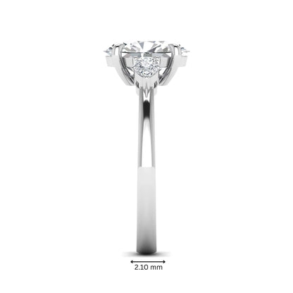Oval cut lab grown diamond three stone engagement ring with pear side diamonds in white gold.
