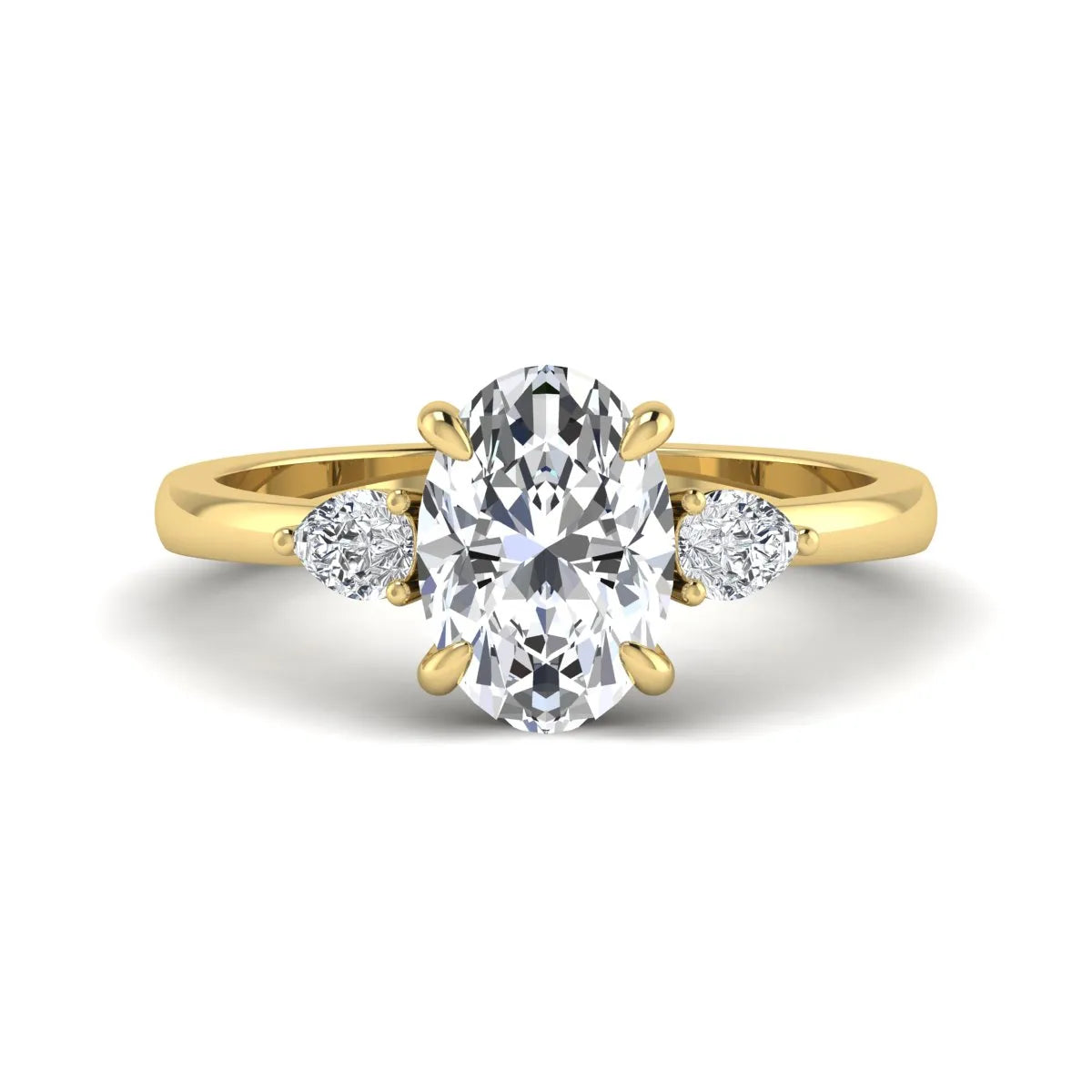 Oval cut lab grown diamond three stone engagement ring with pear side diamonds in yellow gold.