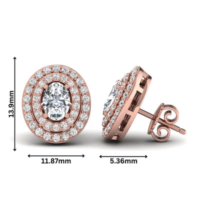 Oval cut lab grown diamond stud earrings featuring a double halo of round cut diamonds, prong setting, push back closure, and rose gold tone design.