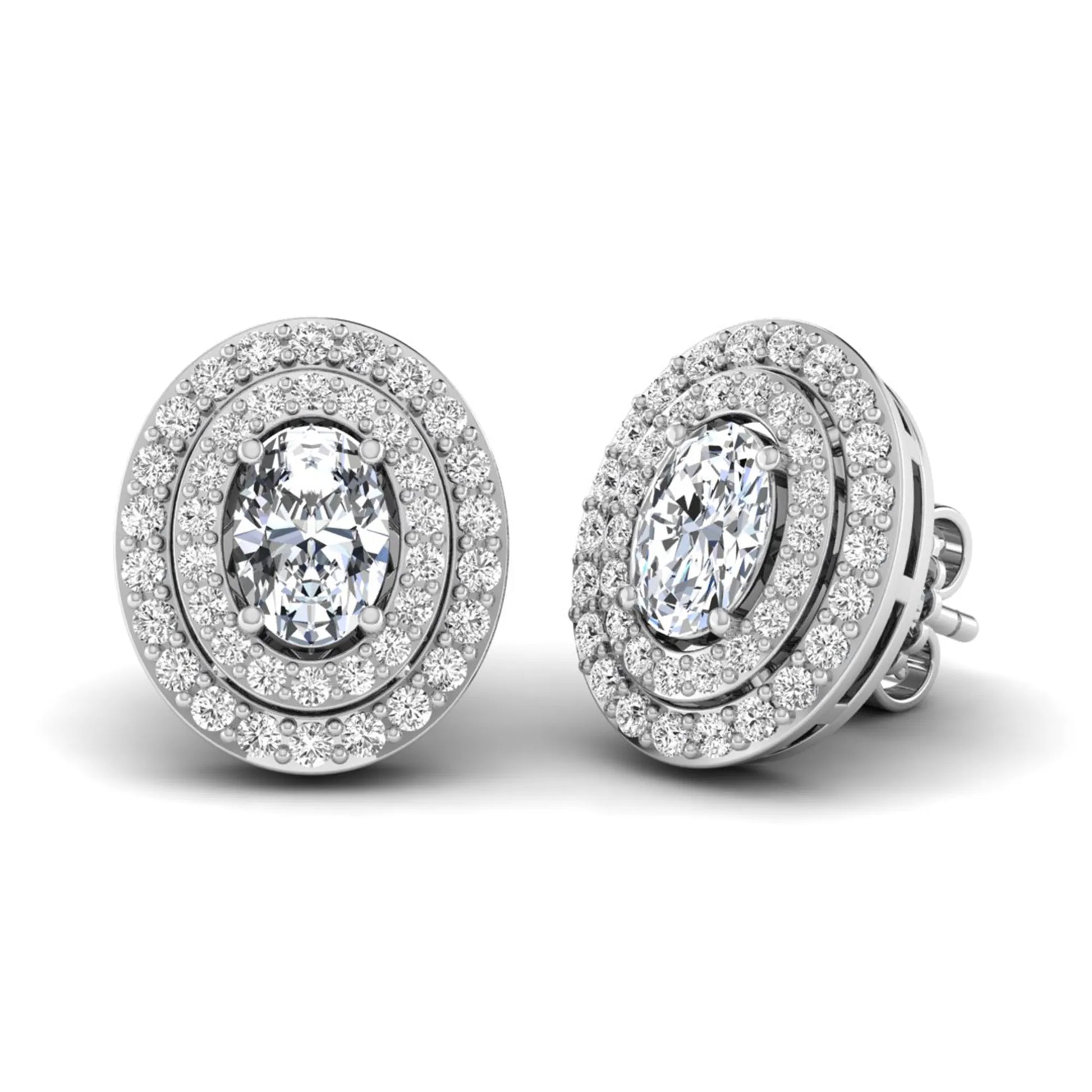 Oval cut lab grown diamond stud earrings featuring a double halo of round cut diamonds, prong setting, push back closure, and white gold tone design.