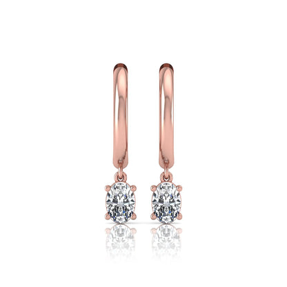 Oval cut lab grown diamond drop huggie hoop earrings featuring a four prong drop setting, hinged snap closure, and polished rose gold tone finish.