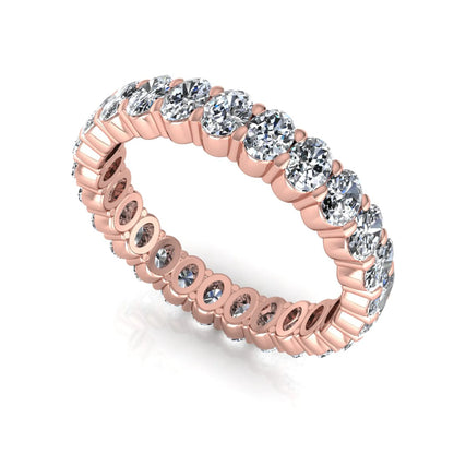 Oval cut lab grown diamond eternity band featuring a continuous row of brilliant shared-prong set diamonds in a timeless luxury design in rose gold
