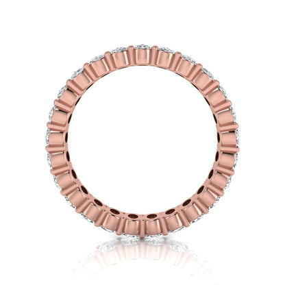 Oval cut lab grown diamond eternity band featuring a continuous row of brilliant shared-prong set diamonds in a timeless luxury design in rose gold