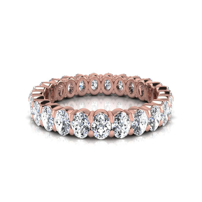 Oval cut lab grown diamond eternity band featuring a continuous row of brilliant shared-prong set diamonds in a timeless luxury design in rose gold