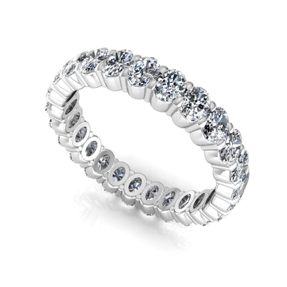 Oval cut lab grown diamond eternity band featuring a continuous row of brilliant shared-prong set diamonds in a timeless luxury design in white gold