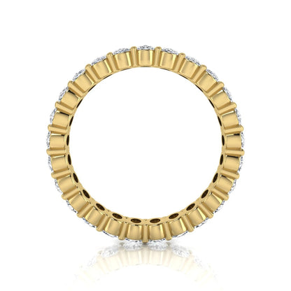 Oval cut lab grown diamond eternity band featuring a continuous row of brilliant shared-prong set diamonds in a timeless luxury design in yellow gold