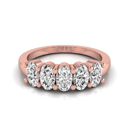 Oval five stone lab grown diamond anniversary ring featuring five oval cut diamonds in an elegant shared prong setting in rose gold