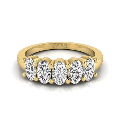 Oval five stone lab grown diamond anniversary ring featuring five oval cut diamonds in an elegant shared prong setting in yellow gold
