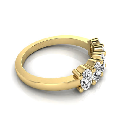 Oval five stone lab grown diamond anniversary ring featuring five oval cut diamonds in an elegant shared prong setting in yellow gold