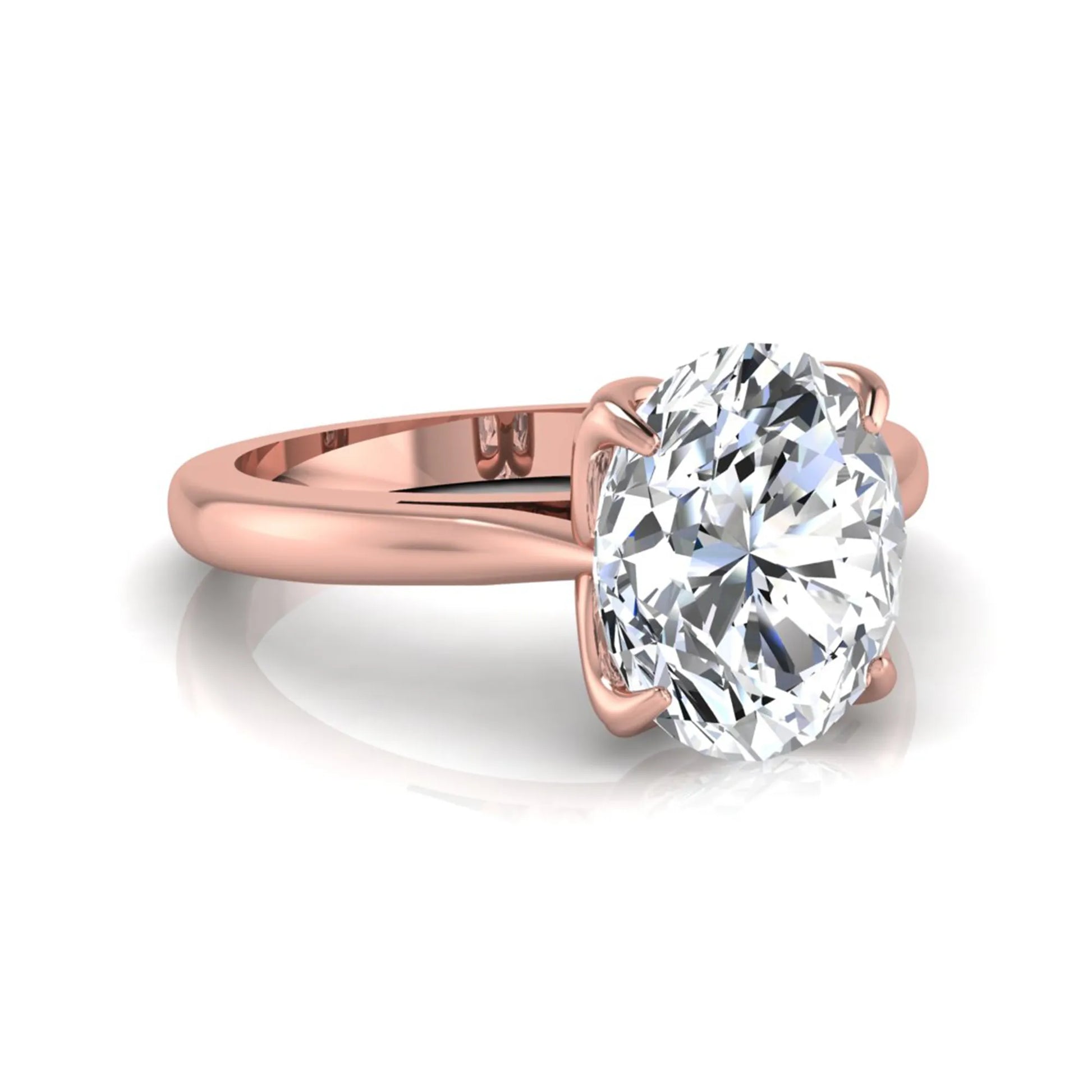 Oval cut lab grown diamond solitaire engagement ring featuring a classic four-prong setting with a rose gold tone band.
