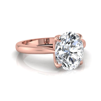 Oval cut lab grown diamond solitaire engagement ring featuring a classic four-prong setting with a rose gold tone band.