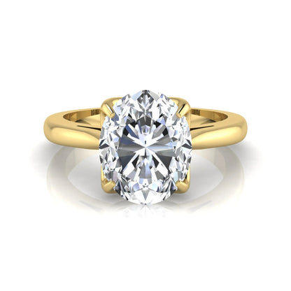 Oval cut lab grown diamond solitaire engagement ring featuring a classic four-prong setting with a yellow gold tone band.