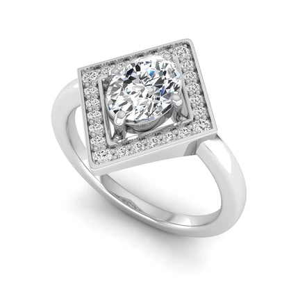 Oval cut lab grown diamond engagement ring with a geometric diamond halo in a white gold setting