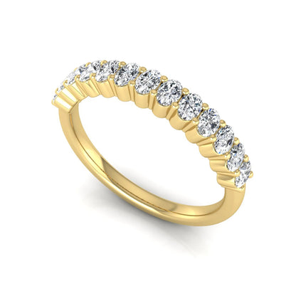 Oval cut lab grown diamond half eternity wedding band in yellow gold tone