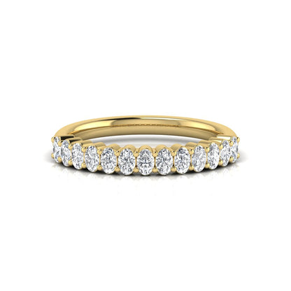 Oval cut lab grown diamond half eternity wedding band in yellow gold tone