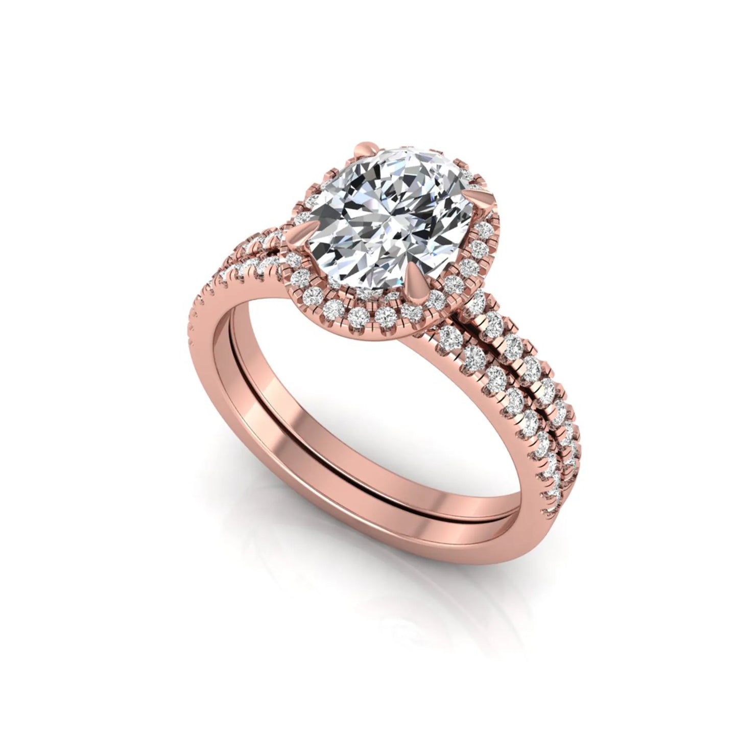 Oval cut lab grown diamond bridal ring set featuring an IGI certified center diamond with a round diamond halo and matching pavé wedding band in rose gold