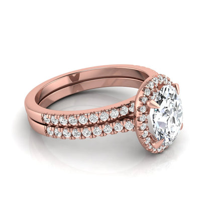 Oval cut lab grown diamond bridal ring set featuring an IGI certified center diamond with a round diamond halo and matching pavé wedding band in rose gold