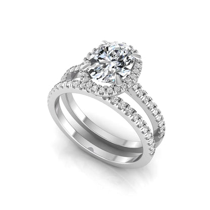 Oval cut lab grown diamond bridal ring set featuring an IGI certified center diamond with a round diamond halo and matching pavé wedding band in white gold