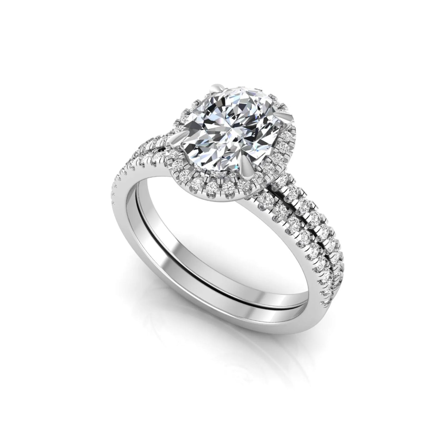 Oval cut lab grown diamond bridal ring set featuring an IGI certified center diamond with a round diamond halo and matching pavé wedding band in white gold