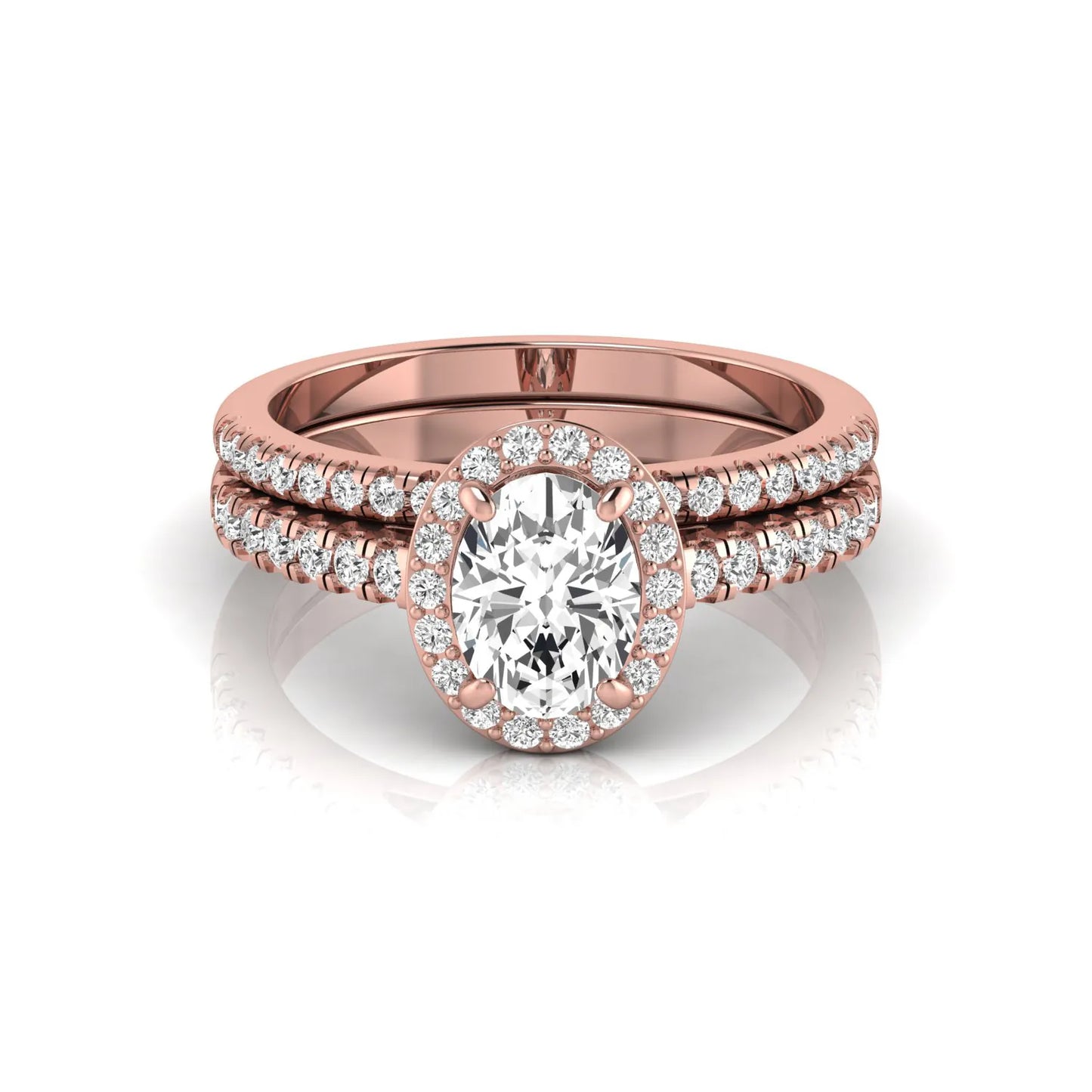 Oval halo lab grown diamond bridal ring set featuring an IGI certified oval cut center diamond with round pavé diamonds in a classic halo setting and matching wedding band in rose gold