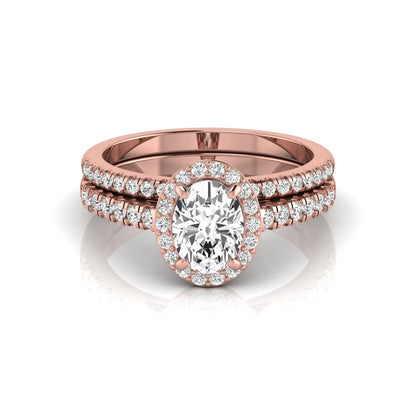 Oval halo lab grown diamond bridal ring set featuring an IGI certified oval cut center diamond with round pavé diamonds in a classic halo setting and matching wedding band in rose gold