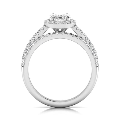 Oval halo lab grown diamond bridal ring set featuring an IGI certified oval cut center diamond with round pavé diamonds in a classic halo setting and matching wedding band in white gold
