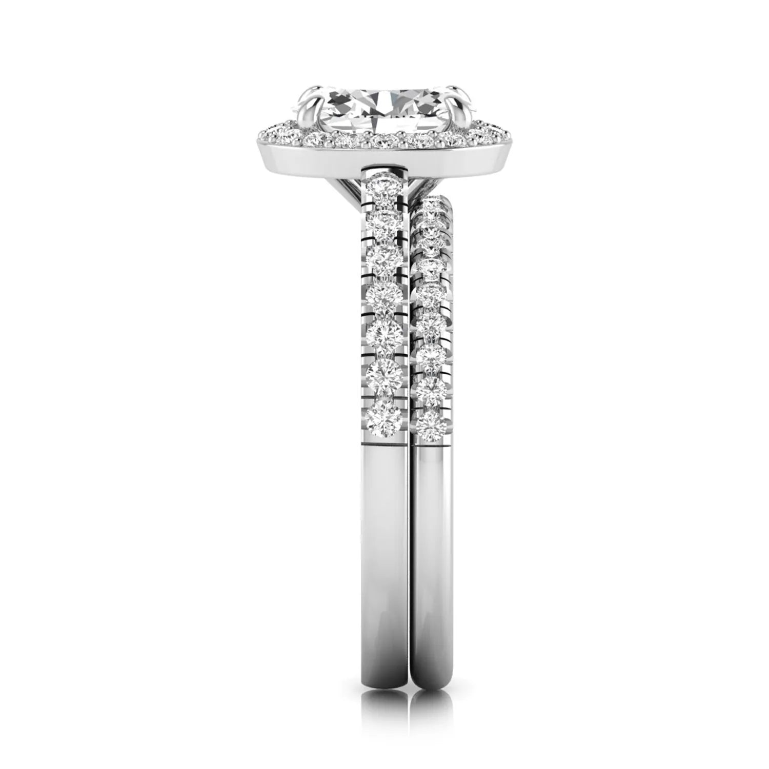 Oval halo lab grown diamond bridal ring set featuring an IGI certified oval cut center diamond with round pavé diamonds in a classic halo setting and matching wedding band in white gold