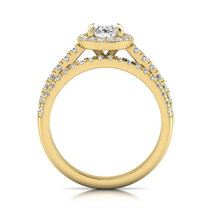 Oval halo lab grown diamond bridal ring set featuring an IGI certified oval cut center diamond with round pavé diamonds in a classic halo setting and matching wedding band in yellow gold
